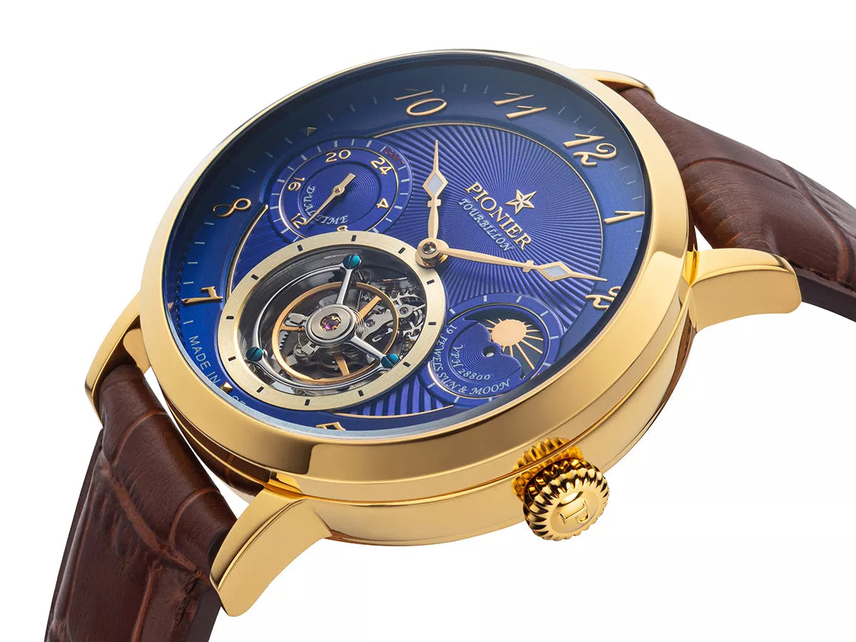 Blue dial with open heart design and arabic numerals with gold case.